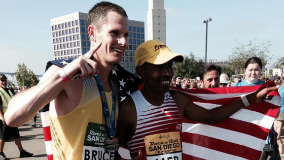 Marathon winner Ben Bruce (left) poses for a picture with Boston Marathon winner Meb Keflezighi (right). 